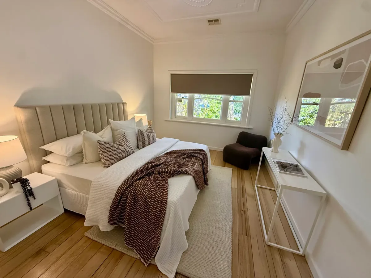 Finished bedroom with sanded hardwood floors after pre-sale renovation works by BMR