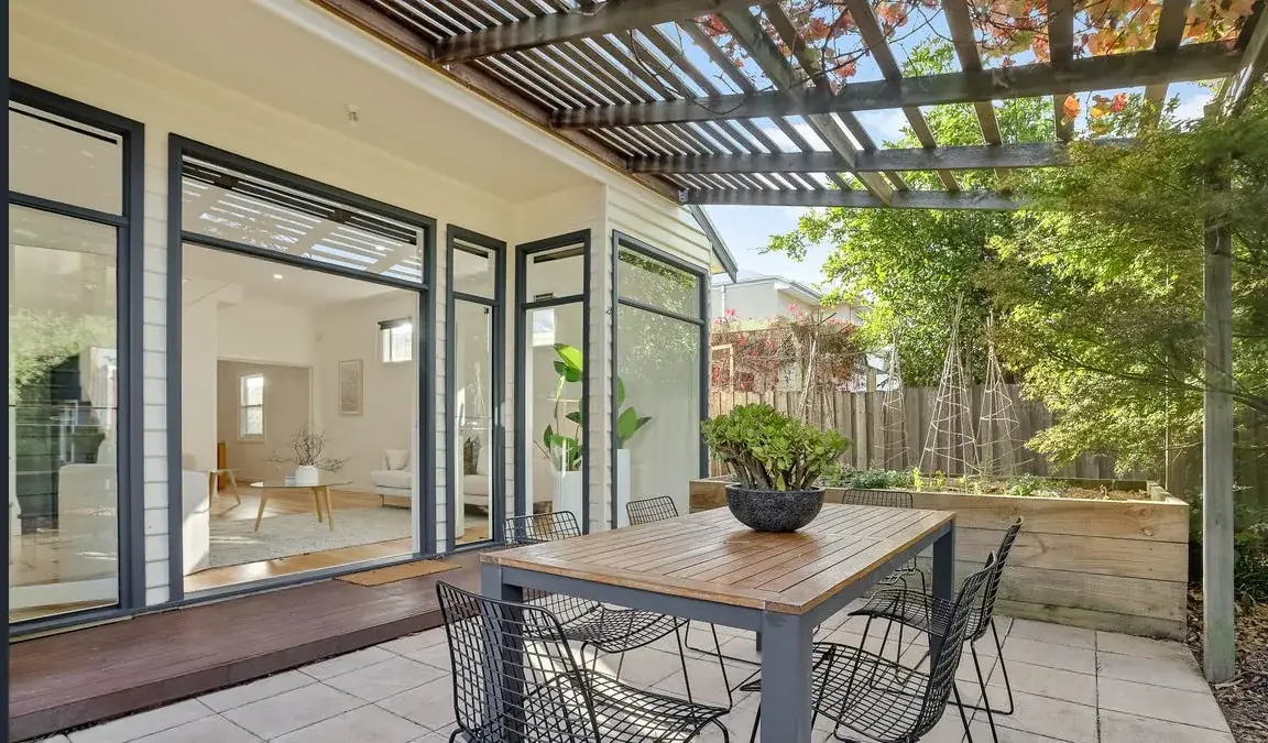 Finished outdoor deck and patio beside a white weatherboard property in Bendigo