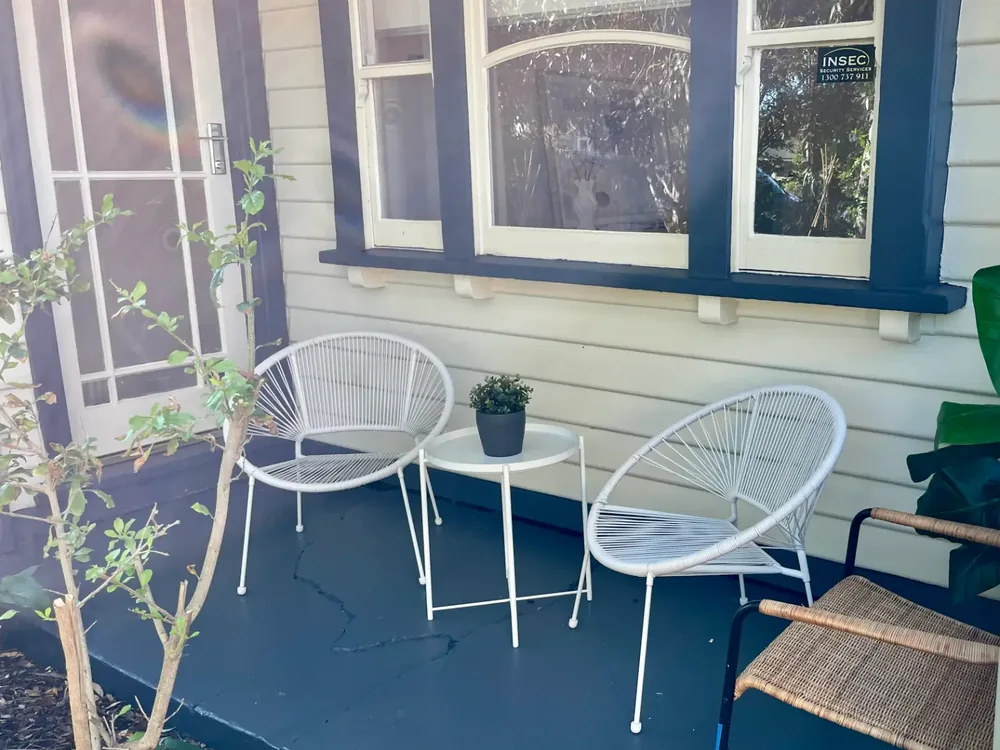 Finished verandah seating area beside a weatherboard property in Bendigo
